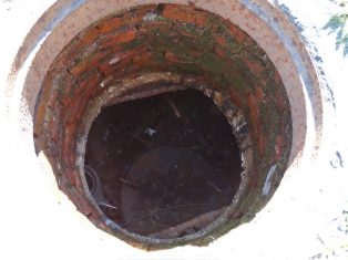 Uncovered manhole.